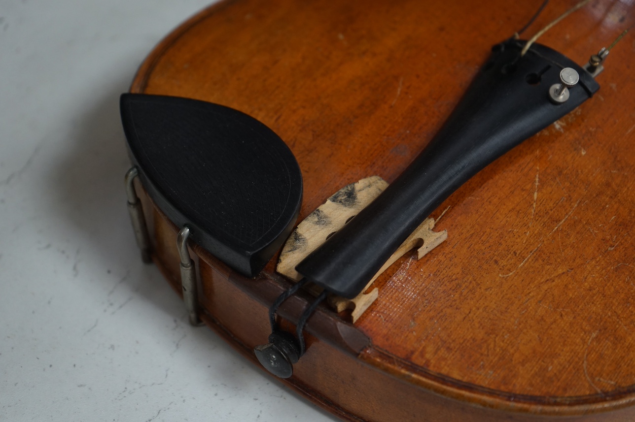 A cased full length violin, circa 1900 with bow, bears Stradivarius label to the interior. CITES Submission reference WVME8714